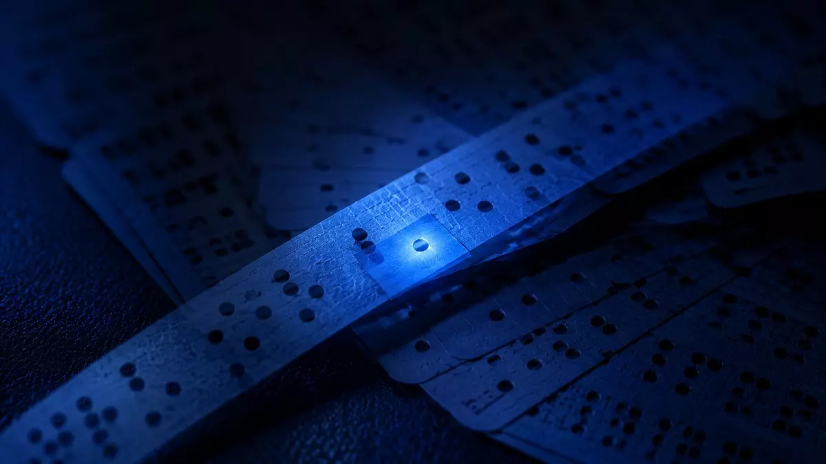 Macro view of vintage paper tape and punch cards with a piece of tape covering one hole, the original software patch